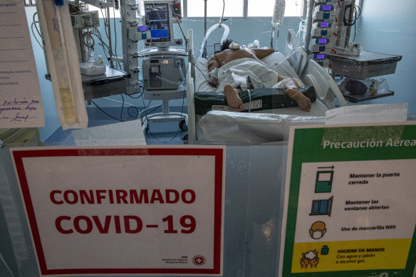 A COVID-19 patient spends Christmas in the Posta Central Hospital in Santiago, Chile. The first shipment of coronavirus vaccines arrived in Chile from Pfizer and its German partner, BioNTech, on December 24.