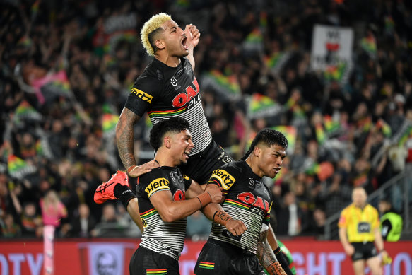 Penrith players celebrate during Saturday night’s victory.