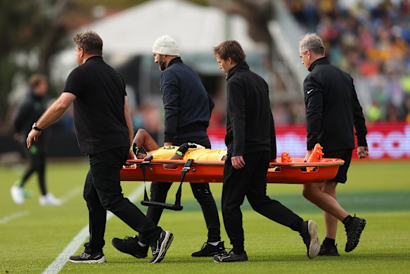 Panama goalkeeper Yenith Bailey is stretchered off the field after landing awkwardly on her knee.