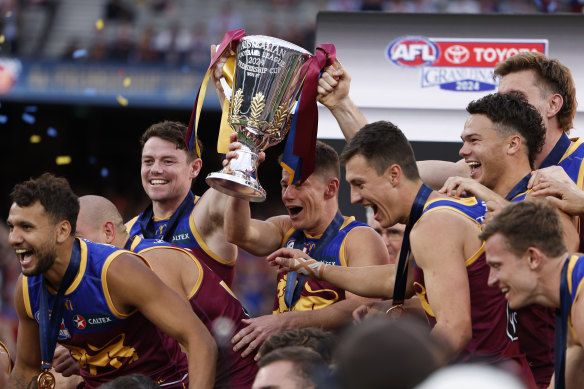 Something to celebrate: The Lions pose for a team photo after their premiership win.