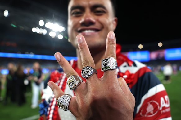 Four to the fore: Spencer Leniu brandishes his premiership bling.