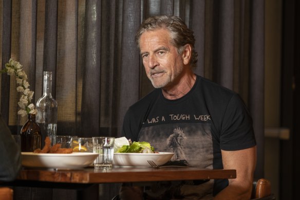 Mark Bouris arrives at lunch with a bit of a shiner from his boxing training.