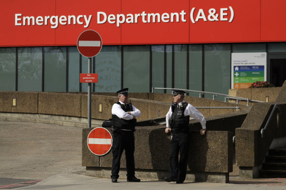 Police officers stand outside St Thomas' Hospital, where Prime Minister Boris Johnson remains in intensive care.