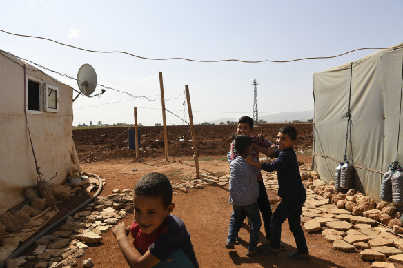 Syrian refugee children play in a temporary refugee camp in the Bekaa Valley, Lebanon.
