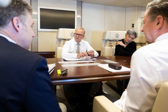 Albanese and Wong talking with senior members of DFAT and the Office of National Intelligence on his way to Tokyo.