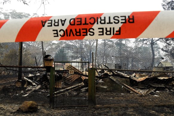 The remains of a house in Wingello. The Australian Academy of Sciences says any bushfire response must extend beyond rebuilding.