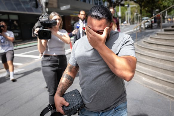 Chami covered his face with his hand as he walked from the court.