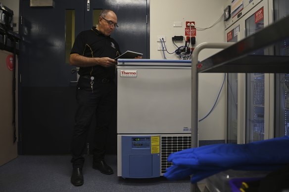 Joe Rosta, the director of pharmacy for Torres and Cape Hospital and Health Service, stands near the freezer at the Thursday Island Hospital that contains the Pfizer COVID-19 vaccinations. 