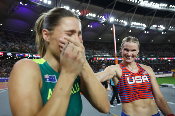 Katie Moon (right) congratulates Nina Kennedy as they share the gold medal in the women’s pole vault at the world championships in Budapest.