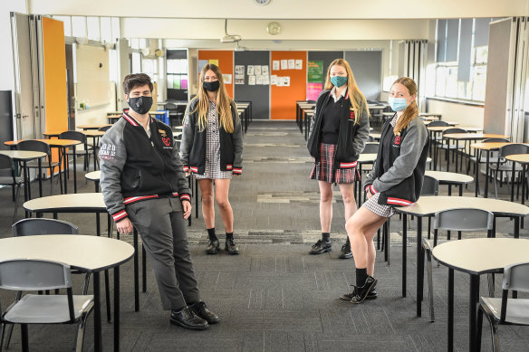 With face masks and long hair: Noah Loven, Chloe Guss, Sophie Rowsell and Bridie Skinner at Glen Eira Secondary College on Wednesday.