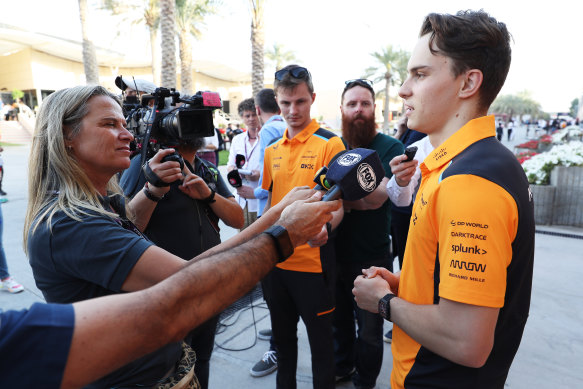 Oscar Piastri talks to media in the paddock during day three of testing in Bahrain.