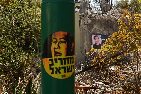 A sticker depicting Israeli Prime Minister Benjamin Netanyahu (left), with the words “Demolisher of Israel”, in Kibbutz Be’eri, where 101 civilians and 31 security personnel were killed by Hamas on October 7.