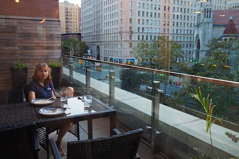 New York story: Jacqueline Lamb on the balcony of a Manhattan apartment.