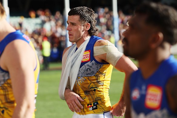 Jake Waterman with his arm in a sling after the Eagles’ loss to Adelaide on Sunday.