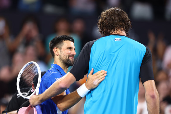 Novak Djokovic of Serbia and Reilly Opelka of the USA after their quarter-final match.