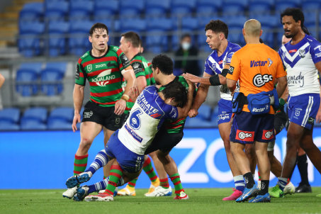 Let’s go ... Lachlan Lewis tackles Cody Walker after the half-time siren.