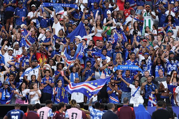 Supporters of Cabo Verde celebrate with their team following the 0-0 draw with Saudi Arabia and qualification for the round of 32.