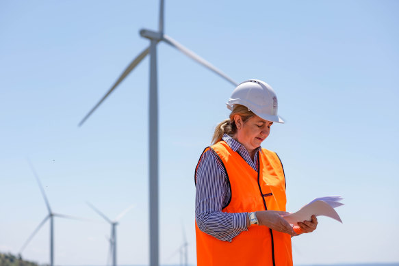 Wind farms like this one visited by Premier Annastacia Palaszczuk near Kingaroy will help make Brisbane Airport Corporation carbon-neutral by 2025.