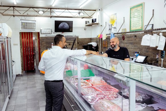 Ahmed Ouf campaigns at a butcher’s shop in Granville.