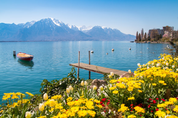 From a train en route to Montreux: flowers, mountains and jetty on Lake Geneva.