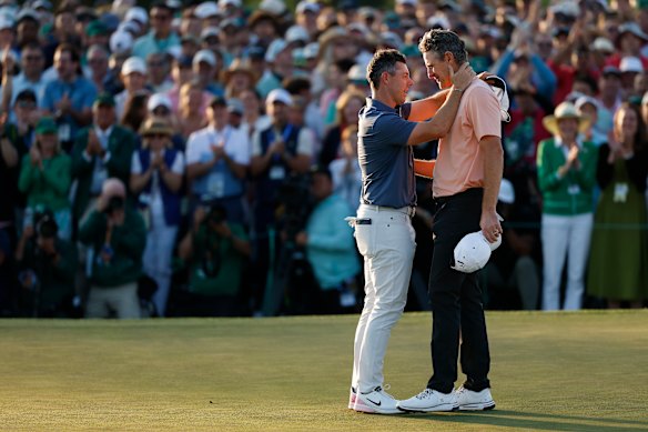 Rory McIlroy shakes hands with Justin Rose. 