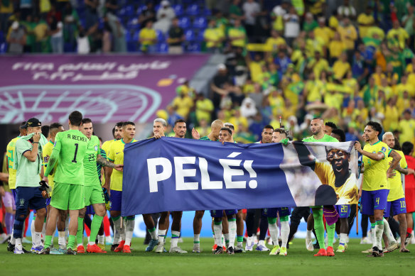 Brazil’s players in Qatar unveil a banner in support of Pele after their 4-1 round-of-16 win over South Korea.