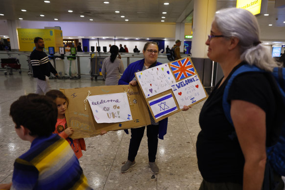 Members of London’s Israeli community greet Australian citizens evacuated from Tel Aviv.