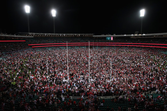 Fans invade the ground after Lance Franklin’s 1000th goal. The full size of the broader Bloods bandwagon could be more than 1 million.