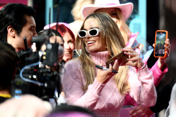 Margot Robbie poses for photos during a Barbie fan event at Westfield Sydney last week. 