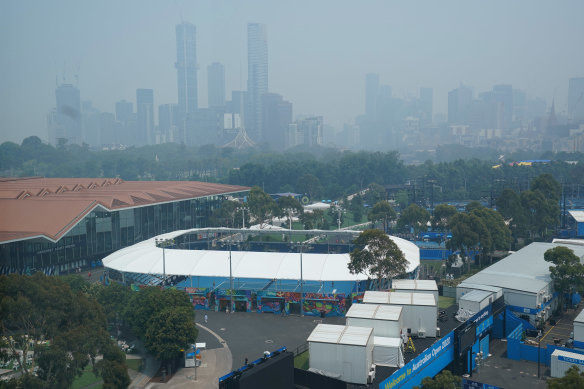 Melbourne's skyline is shrouded in bushfire smoke haze, with Melbourne Park, where Australian Open qualifying is taking place, in the foreground.