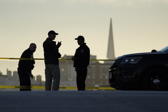 Police stand at the top of the closed street outside the home of Paul Pelosi, the husband of House Speaker Nancy Pelosi, in San Francisco.