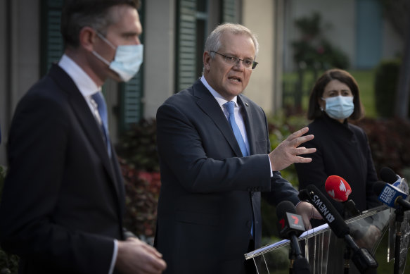 Prime Minister Scott Morrison, flanked by NSW Treasurer Dominic Perrottet and Premier Gladys Berejiklian.