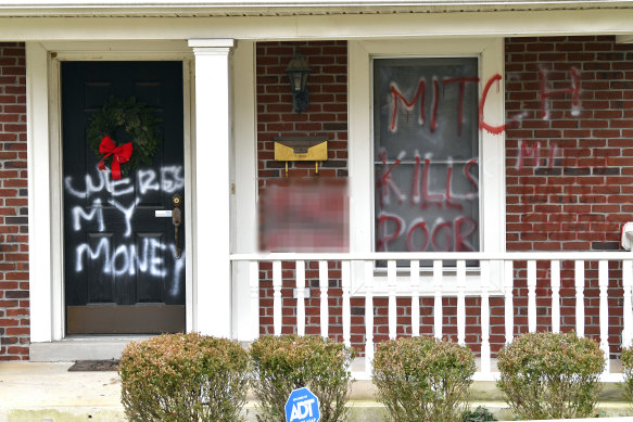 Mitch McConnell's Kentucky home was vandalised after he blocked moves to increase stimulus cheques. 