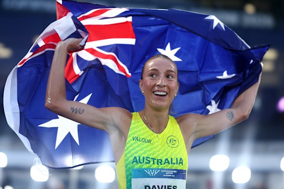Davies celebrates claiming gold in the women’s 10,000m.