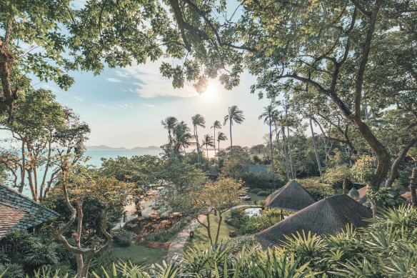 Villas are tucked into the lush hillside which leads to the beach lagoon.