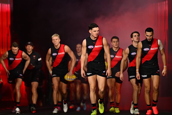 The Bombers walk onto the MCG.