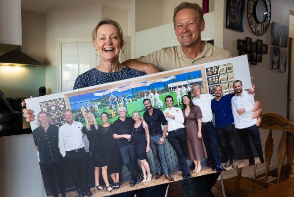 Terry and Jackie De Koning, the parents of young AFL stars Tom (Carlton) and Sam (Geelong) with a giant family photo including all 10 children.