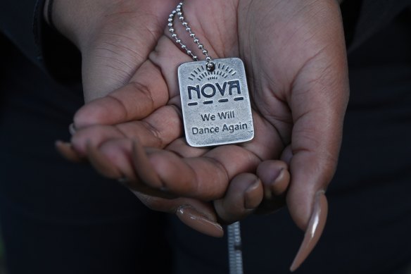October 7 attack survivor Mazal Tazazo holds a pendant given to her by a fellow survivor of the Nova festival massacre.