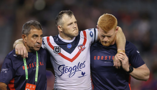 A devastated Brett Morris leaves the field injured after suffering a serious knee injury.