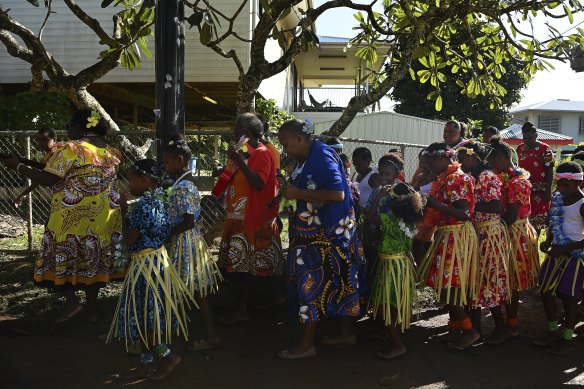 Community members, elders and school children sing during the Mabo Day parade along a street on Boigu Island in the Torres Strait celebrating the first successful native title claim on June 3rd 1992.