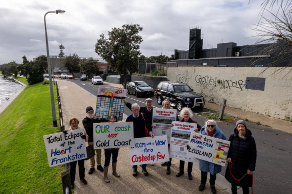 Members of the “Stop the Great Wall of Frankston” community campaign outside the site of one of the proposed towers.
