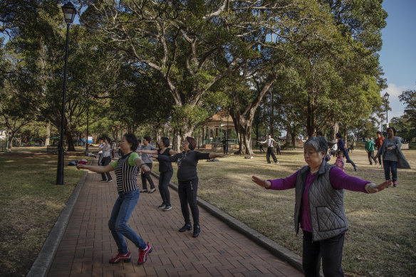 Tai chi participants in Burwood Park.