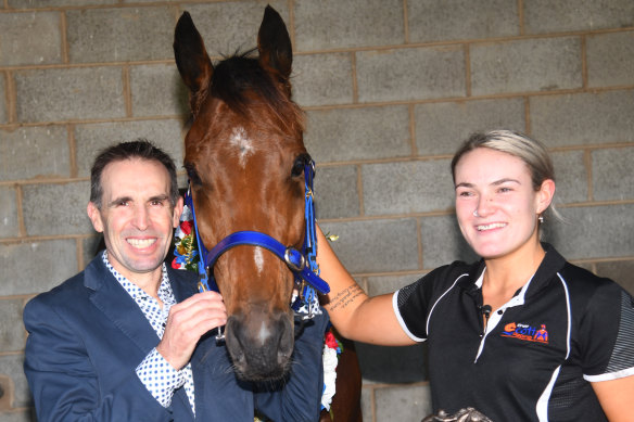 Trainer Brett Scott and daughter Tylah pose with The Statesman after winning the Sovereign Resort Galleywood Hurdle, during the Warrnambool Jumps Carnival.