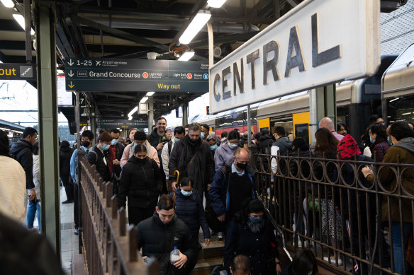 Crowds gather at Central Station in Sydney, as trains ran on a reduced timetable in July.