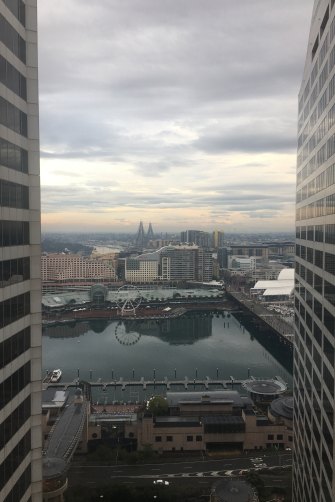 The motionless ferris wheel in Darling Harbour, seen from the hotel room, looked like a broken clock.