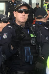 Police have denied that  Senior Constable Travis Gray's hand gesture was used as a ‘white power’ symbol.