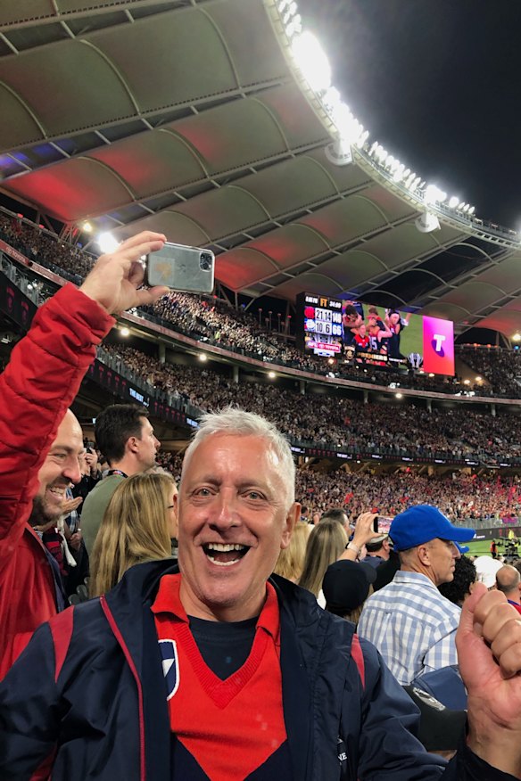 Melbourne supporter and 1970s cheer squad member Harry Laumets on the final siren in Perth. He flew from the Gold Coast to Tasmania to quarantine, which meant he was allowed into Western Australia. 