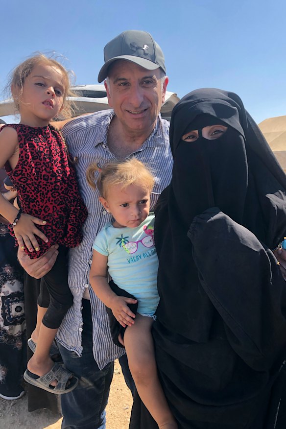 Kamalle Dabboussy with Mariam and her daughters Aisha, left, and Fatema, during his brief visit to the Al-Hawl refugee camp in Syria in 2019.