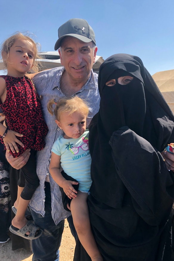 Kamalle with Mariam and her daughters Aisha, left, and Fatema, during his brief visit to the Al-Hol refugee camp in Syria in 2019.