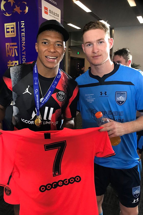 Parting gift: Sydney FC's Harry Van der Saag is given Kylian Mbappe's match shirt in his starting debut.